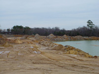 See if you can spot the fossil collectors.  Most fossils were found in the piles of matrix on the far side of the lake.